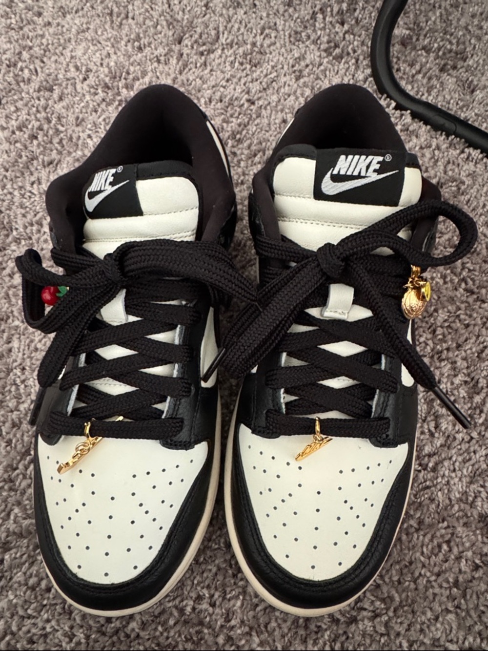 Nike Black and White Low-Top Sneakers with Gold Accents
